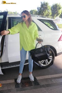 rakul preet singh in a green shirt and blue denim jeans