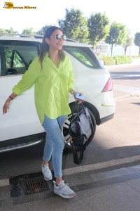 rakul preet singh in a green shirt and blue denim jeans