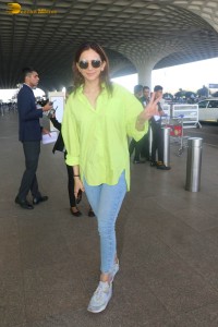 rakul preet singh in a green shirt and blue denim jeans
