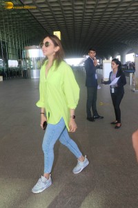 rakul preet singh in a green shirt and blue denim jeans