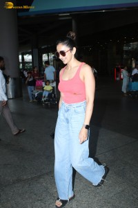 Rakul Preet Singh chic look dressed in a red top and blue denim jeans