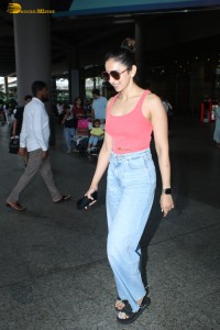 Rakul Preet Singh chic look dressed in a red top and blue denim jeans