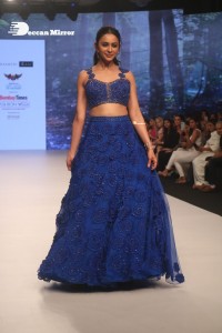 Rakul Preet Singh walks the ramp in a blue lehenga choli at the Bombay Times fashion week