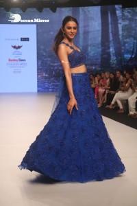 Rakul Preet Singh walks the ramp in a blue lehenga choli at the Bombay Times fashion week