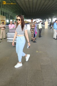 Actress Rakul Preet Singh at Airport wearing a black and white t-shirt