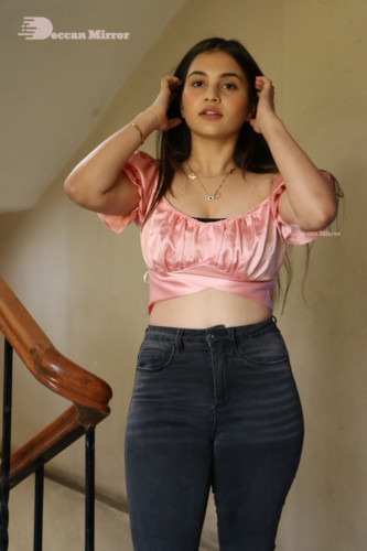 Telugu Actress Ramya Pasupuleti poses in a pink top and black jeans