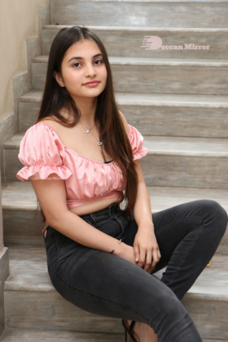 Telugu Actress Ramya Pasupuleti poses in a pink top and black jeans