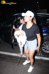 Indian TV Actress Rashami Desai was spotted with her cute furry friend at Mumbai Airport