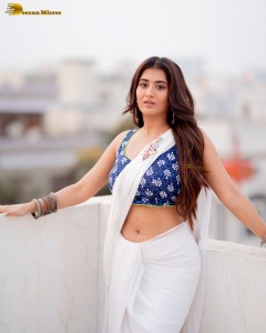 actress Rashi Singh ravishing in a white saree