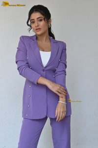 actress Rashi Singh in a violet pantsuit