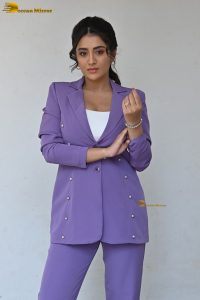 actress Rashi Singh in a violet pantsuit