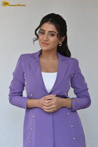 actress Rashi Singh in a violet pantsuit