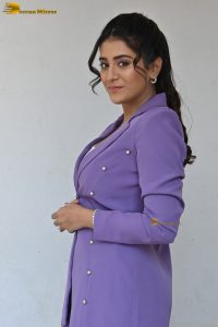 actress Rashi Singh in a violet pantsuit