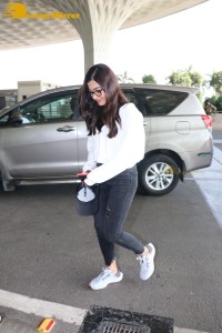 Rashmika Mandanna in a grey hoodie and black jeans at airport