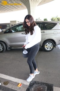 Rashmika Mandanna in a grey hoodie and black jeans at airport