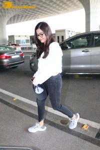 Rashmika Mandanna in a grey hoodie and black jeans at airport
