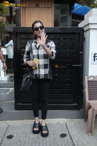 actress rashmika mandanna in a black and white shirt seen visiting a restaurant