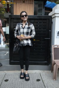 actress rashmika mandanna in a black and white shirt seen visiting a restaurant