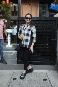 actress rashmika mandanna in a black and white shirt seen visiting a restaurant