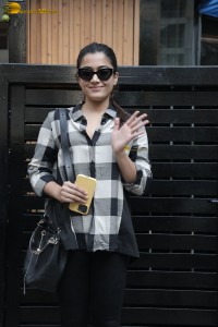 actress rashmika mandanna in a black and white shirt seen visiting a restaurant