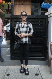 actress rashmika mandanna in a black and white shirt seen visiting a restaurant
