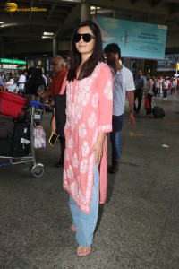 actress Rashmika Mandanna in a pink dress at mumbai airport