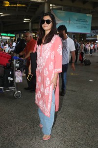 actress Rashmika Mandanna in a pink dress at mumbai airport