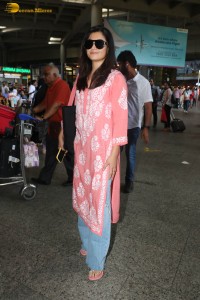 actress Rashmika Mandanna in a pink dress at mumbai airport