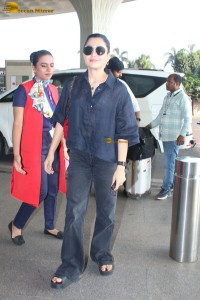 actress Rashmika Mandanna in dark denim overalls at mumbai airport