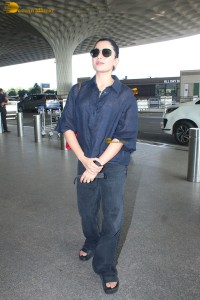 actress Rashmika Mandanna in dark denim overalls at mumbai airport