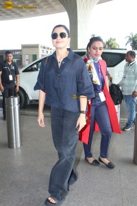 actress Rashmika Mandanna in dark denim overalls at mumbai airport