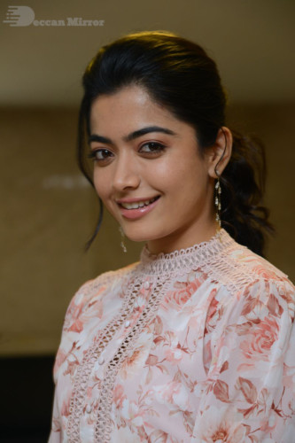 Telugu Actress Rashmika Mandanna photoshoot in a orange and white dress