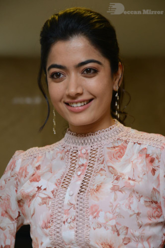Telugu Actress Rashmika Mandanna photoshoot in a orange and white dress