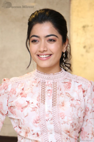 Telugu Actress Rashmika Mandanna photoshoot in a orange and white dress
