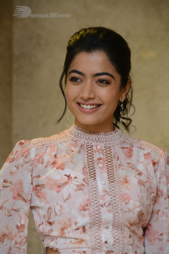 Telugu Actress Rashmika Mandanna photoshoot in a orange and white dress