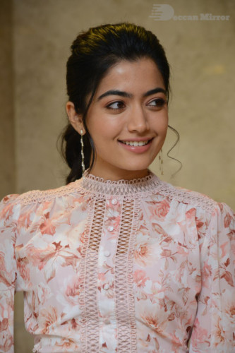 Telugu Actress Rashmika Mandanna photoshoot in a orange and white dress