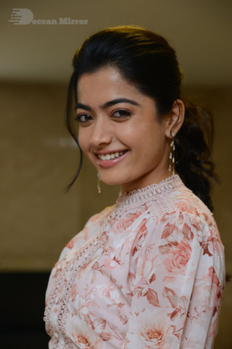 Telugu Actress Rashmika Mandanna photoshoot in a orange and white dress