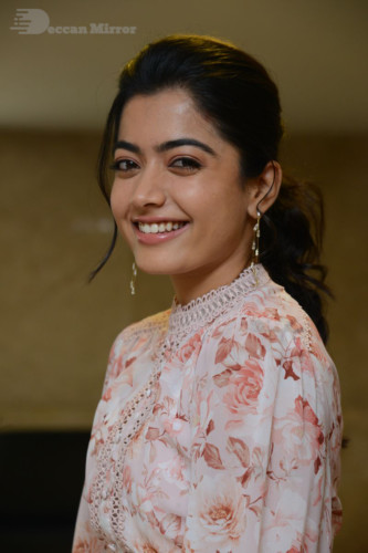 Telugu Actress Rashmika Mandanna photoshoot in a orange and white dress