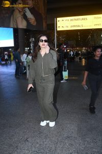 bollywood actress Raveena Tandon cute in a green dress at airport