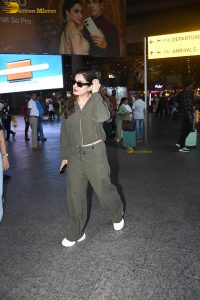 bollywood actress Raveena Tandon cute in a green dress at airport