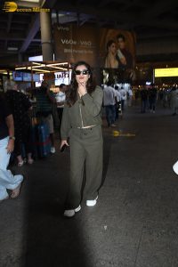 bollywood actress Raveena Tandon cute in a green dress at airport