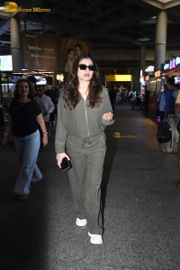 bollywood actress Raveena Tandon cute in a green dress at airport