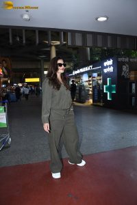 bollywood actress Raveena Tandon cute in a green dress at airport