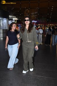 bollywood actress Raveena Tandon cute in a green dress at airport