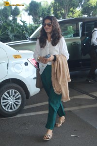bollywood actress Raveena Tandon was spotted in a stylish outfit at mumbai airport