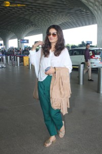 bollywood actress Raveena Tandon was spotted in a stylish outfit at mumbai airport