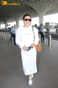 Raveena Tandon dressed in all white while traveling from Mumbai Airport