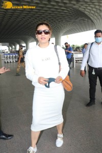 Raveena Tandon dressed in all white while traveling from Mumbai Airport