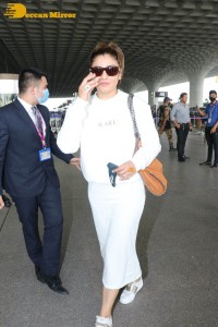 Raveena Tandon dressed in all white while traveling from Mumbai Airport