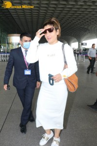 Raveena Tandon dressed in all white while traveling from Mumbai Airport